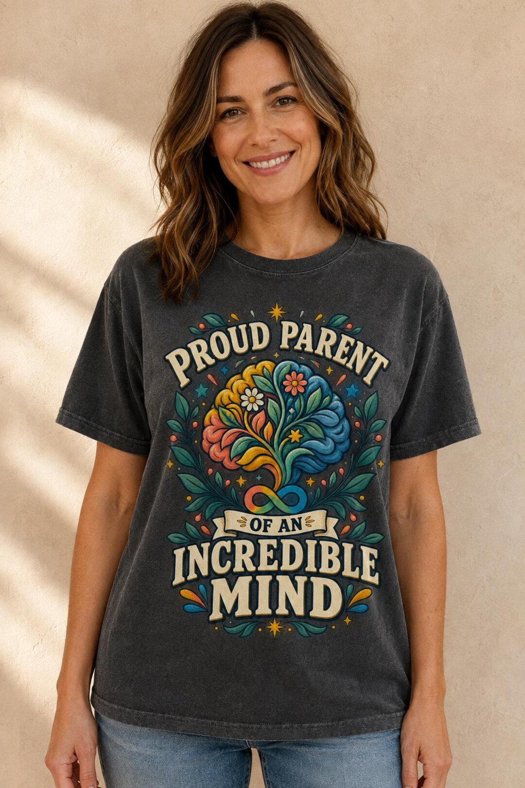 Model wearing the Proud Parent of an Incredible Mind Autism Acceptance Shirt